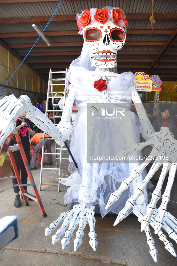 Workers of the 'Taller el Volador' made  the manufacture of skulls and catrinas that will be used for the Day of the Dead Parade inspired by...