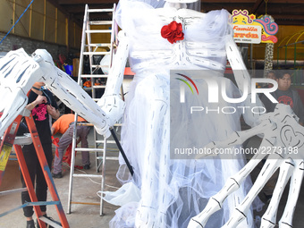 Workers of the 'Taller el Volador' made  the manufacture of skulls and catrinas that will be used for the Day of the Dead Parade inspired by...