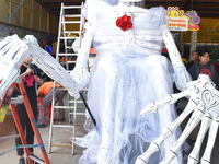 Workers of the 'Taller el Volador' made  the manufacture of skulls and catrinas that will be used for the Day of the Dead Parade inspired by...