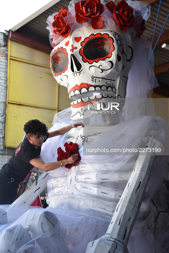 Workers of the 'Taller el Volador' made  the manufacture of skulls and catrinas that will be used for the Day of the Dead Parade inspired by...