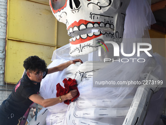 Workers of the 'Taller el Volador' made  the manufacture of skulls and catrinas that will be used for the Day of the Dead Parade inspired by...