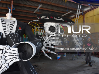 Workers of the 'Taller el Volador' made  the manufacture of skulls and catrinas that will be used for the Day of the Dead Parade inspired by...