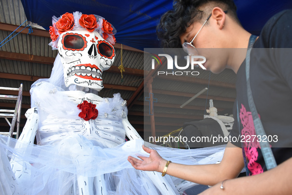 Workers of the 'Taller el Volador' made  the manufacture of skulls and catrinas that will be used for the Day of the Dead Parade inspired by...