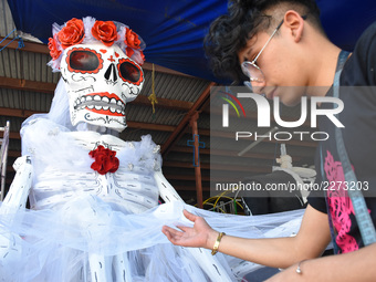 Workers of the 'Taller el Volador' made  the manufacture of skulls and catrinas that will be used for the Day of the Dead Parade inspired by...