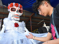 Workers of the 'Taller el Volador' made  the manufacture of skulls and catrinas that will be used for the Day of the Dead Parade inspired by...