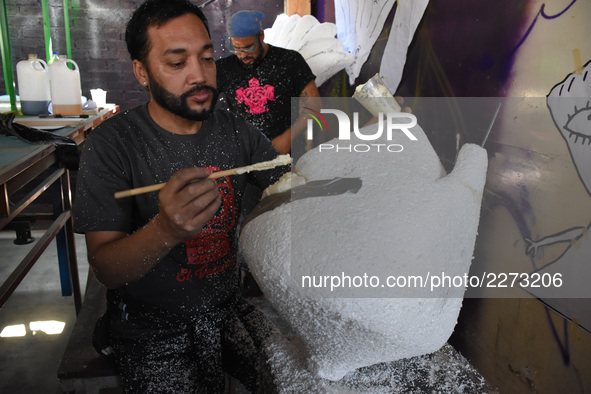 Workers of the 'Taller el Volador' made  the manufacture of skulls and catrinas that will be used for the Day of the Dead Parade inspired by...