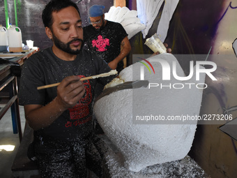 Workers of the 'Taller el Volador' made  the manufacture of skulls and catrinas that will be used for the Day of the Dead Parade inspired by...