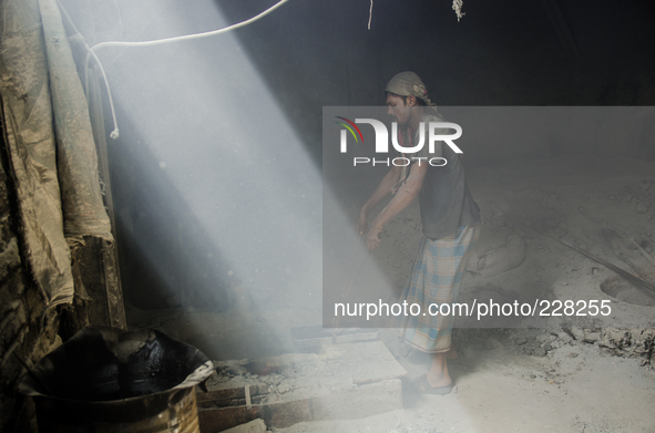 DHAKA, BANGLADESH. Worker is seen in the lead mill, without any safety protection. Bangladesh has one of the highest air lead levels in the...