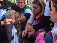 Teachers of the early childhood sector in Roma, protest at the piazza del campidoglio by chained up at the Marc aurel statue  against labour...