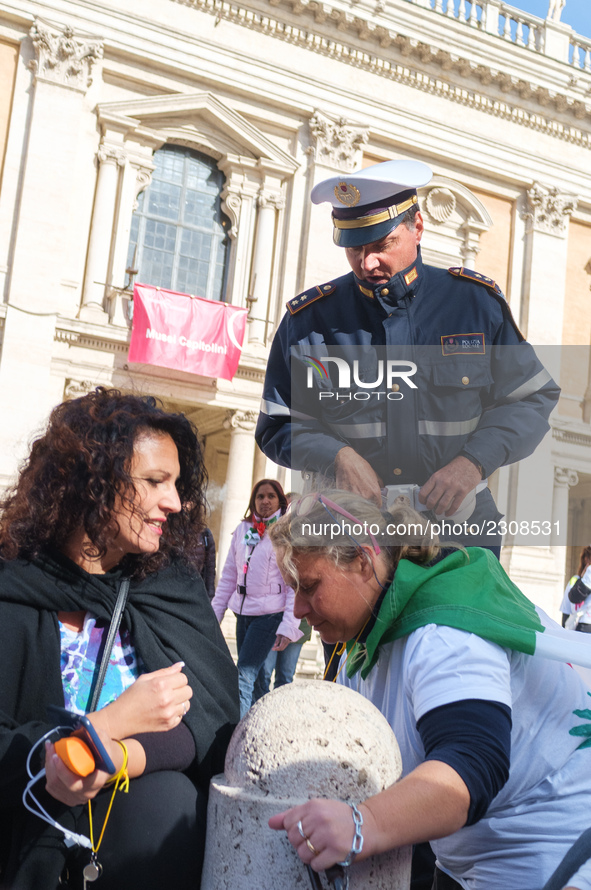 Teachers of the early childhood sector in Roma, protest at the piazza del campidoglio by chained up at the Marc aurel statue  against labour...