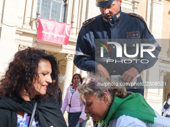 Teachers of the early childhood sector in Roma, protest at the piazza del campidoglio by chained up at the Marc aurel statue  against labour...