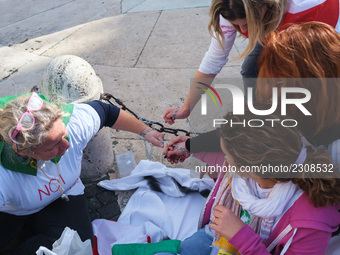 Teachers of the early childhood sector in Roma, protest at the piazza del campidoglio by chained up at the Marc aurel statue  against labour...