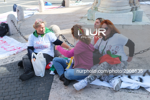 Teachers of the early childhood sector in Roma, protest at the piazza del campidoglio by chained up at the Marc aurel statue  against labour...