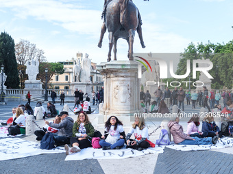 Teachers of the early childhood sector in Roma, protest at the piazza del campidoglio by chained up at the Marc aurel statue  against labour...