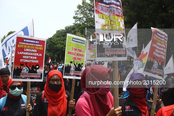 Thousands of workers surrounded the Jakarta Governor's office during a demonstration against the 2018 Regional Minimum Wage (UMP) award at J...