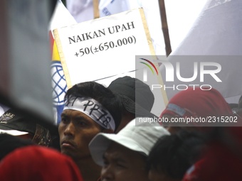 Thousands of workers surrounded the Jakarta Governor's office during a demonstration against the 2018 Regional Minimum Wage (UMP) award at J...