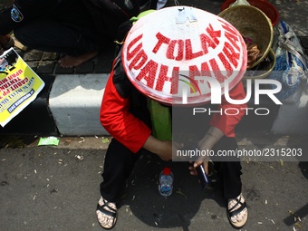 Thousands of workers surrounded the Jakarta Governor's office during a demonstration against the 2018 Regional Minimum Wage (UMP) award at J...