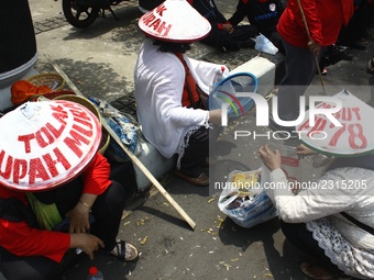 Thousands of workers surrounded the Jakarta Governor's office during a demonstration against the 2018 Regional Minimum Wage (UMP) award at J...