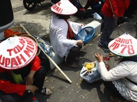 Thousands of workers surrounded the Jakarta Governor's office during a demonstration against the 2018 Regional Minimum Wage (UMP) award at J...