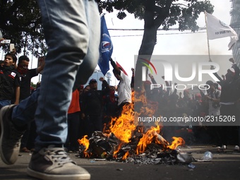 Thousands of workers surrounded the Jakarta Governor's office during a demonstration against the 2018 Regional Minimum Wage (UMP) award at J...