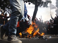 Thousands of workers surrounded the Jakarta Governor's office during a demonstration against the 2018 Regional Minimum Wage (UMP) award at J...