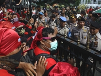 Thousands of workers surrounded the Jakarta Governor's office during a demonstration against the 2018 Regional Minimum Wage (UMP) award at J...