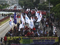 Thousands of workers surrounded the Jakarta Governor's office during a demonstration against the 2018 Regional Minimum Wage (UMP) award at J...