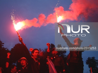 Thousands of workers surrounded the Jakarta Governor's office during a demonstration against the 2018 Regional Minimum Wage (UMP) award at J...