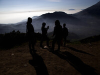 Visitors at the top of Sikunir Mountain in Dieng. Dieng plateau in Central Java, is part of the district of Banjarnegara and Wonosobo regenc...