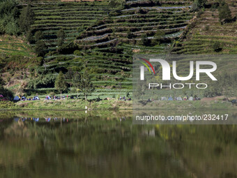 Visitors campsite at the bottom of Sikunir Mountain at Dieng. Dieng plateau in Central Java, is part of the district of Banjarnegara and Won...