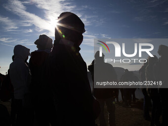 People enjoying sunrise from Top of Sikunir Mountain at Dieng. Dieng plateau in Central Java, is part of the district of Banjarnegara and Wo...