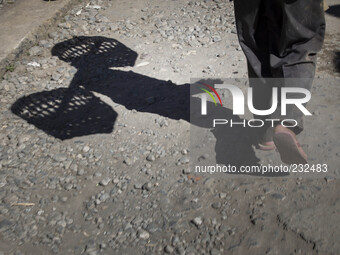 Potatoe farmer at dieng on his way to get fertilizer for his potatoes farm. Dieng plateau in Central Java, is part of the district of Banjar...