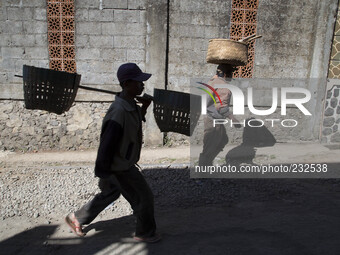 Farmers on their way to their potatoes farm at Dieng. Dieng plateau in Central Java, is part of the district of Banjarnegara and Wonosobo re...