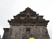 a child pose for photograph at Temple complex in Dieng. Dieng plateau in Central Java, is part of the district of Banjarnegara and Wonosobo...