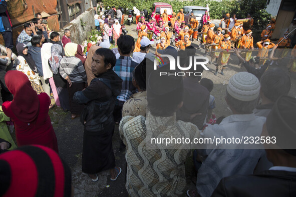 people watching the marching band performance during the villagers karnaval at Dieng. Dieng plateau in Central Java, is part of the district...