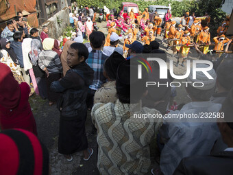 people watching the marching band performance during the villagers karnaval at Dieng. Dieng plateau in Central Java, is part of the district...