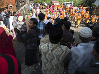 people watching the marching band performance during the villagers karnaval at Dieng. Dieng plateau in Central Java, is part of the district...