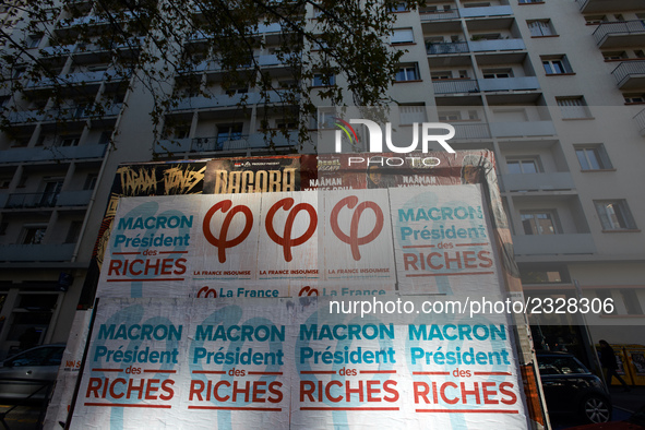 A poster of the 'France Insoumise' party on French President Macron reading 'Macron president of the wealthy'. More than 4000 protesters too...