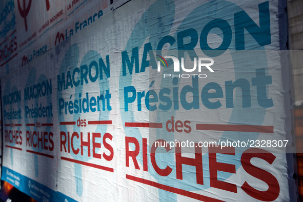 A poster of the 'France Insoumise' party on French President Macron reading 'Macron president of the wealthy'. More than 4000 protesters too...