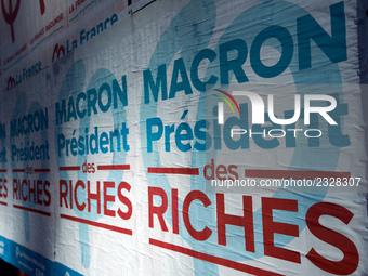 A poster of the 'France Insoumise' party on French President Macron reading 'Macron president of the wealthy'. More than 4000 protesters too...