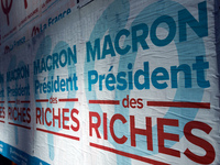 A poster of the 'France Insoumise' party on French President Macron reading 'Macron president of the wealthy'. More than 4000 protesters too...