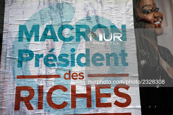 A poster of the 'France Insoumise' party on French President Macron reading 'Macron president of the wealthy'. More than 4000 protesters too...