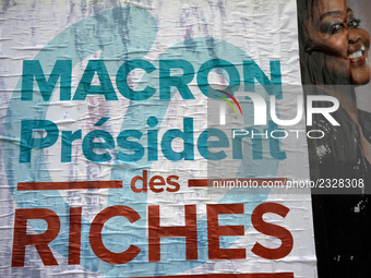 A poster of the 'France Insoumise' party on French President Macron reading 'Macron president of the wealthy'. More than 4000 protesters too...