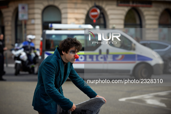 A clown gestures near a police van at the end of the demonstration. More than 4000 protesters took to the streets of Toulouse against the ne...