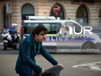 A clown gestures near a police van at the end of the demonstration. More than 4000 protesters took to the streets of Toulouse against the ne...