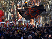 An anarchist flag during the protest. More than 4000 protesters took to the streets of Toulouse against the new Macron's reforms on the Work...