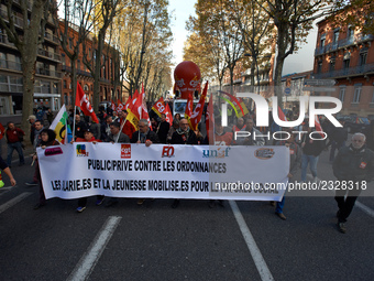 A banner reading 'Private/public against ordonnaces, employees and youngs for social progress'. More than 4000 protesters took to the street...