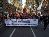 A banner reading 'Private/public against ordonnaces, employees and youngs for social progress'. More than 4000 protesters took to the street...