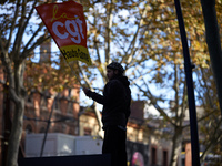 A man holds a flag of the CGT trade union. More than 4000 protesters took to the streets of Toulouse against the new Macron's reforms on the...