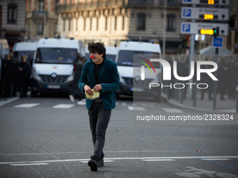 A clown plays in front of riot police. More than 4000 protesters took to the streets of Toulouse against the new Macron's reforms on the Wor...